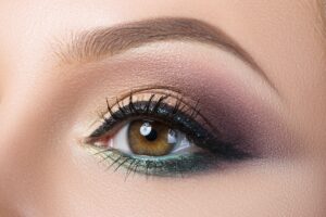 Close-up of woman's eye with creative modern make-up